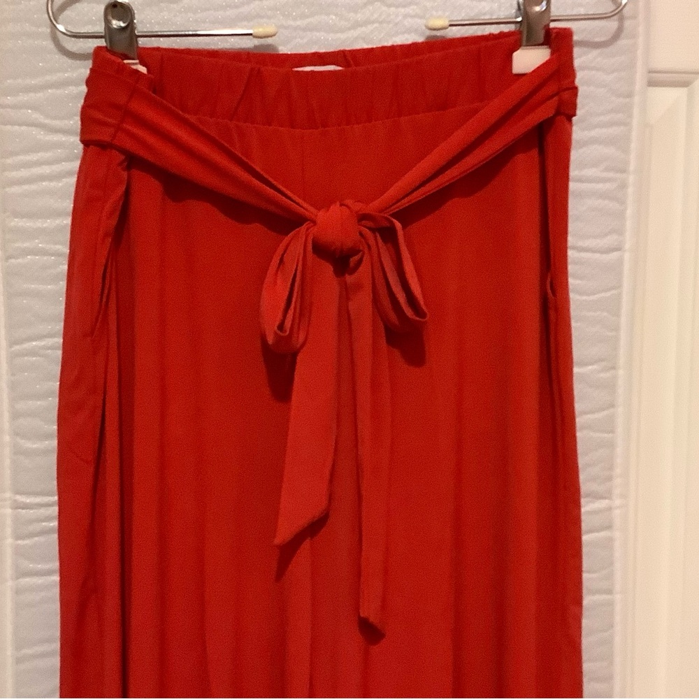 Red Maxi Jumpsuit with Tie Front and Pleated A-Line Style
